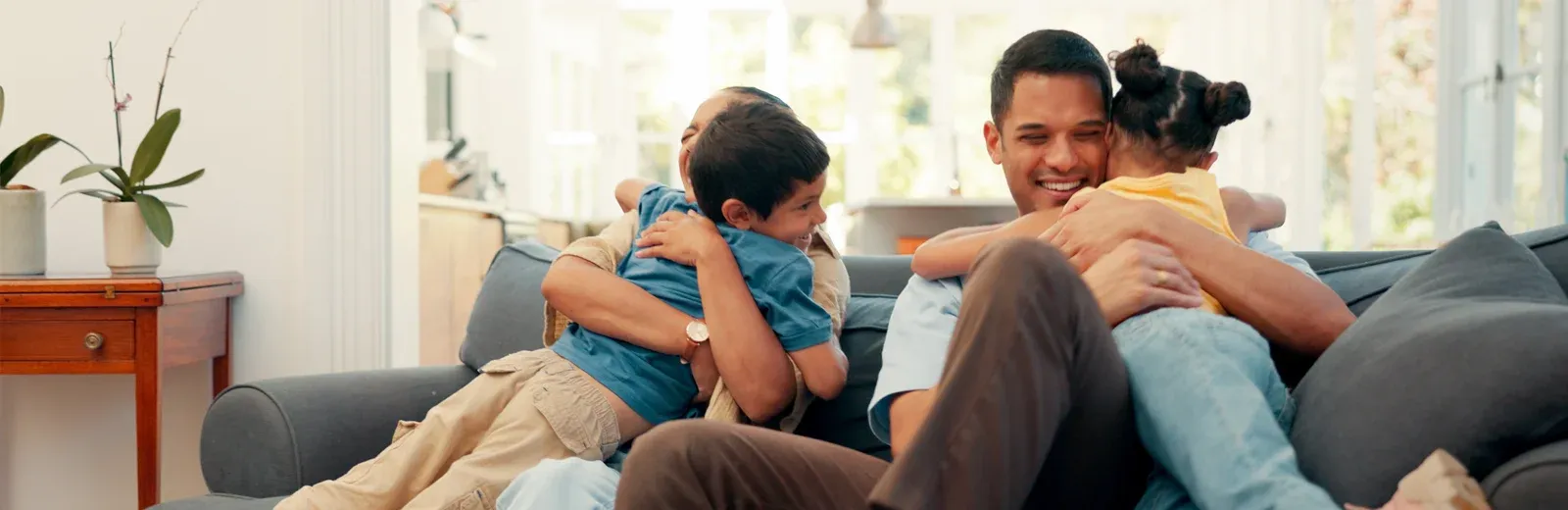 family laughing and playing in pest free home